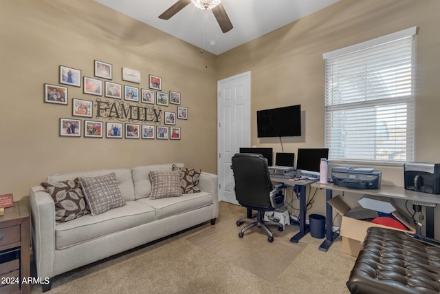 home office with ceiling fan and light colored carpet