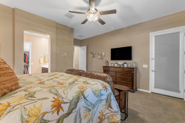 bedroom with ceiling fan, a closet, carpet, and a spacious closet