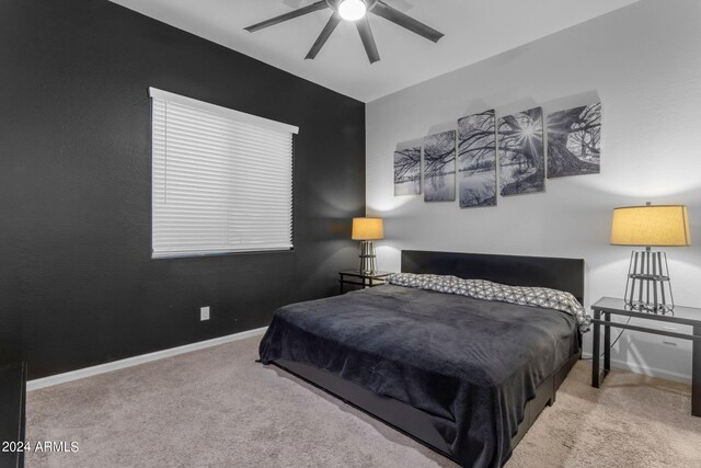 carpeted bedroom with ceiling fan