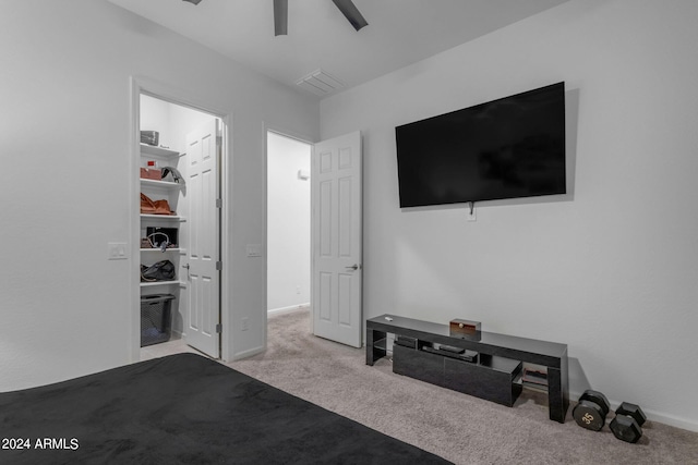 bedroom featuring ceiling fan and light colored carpet