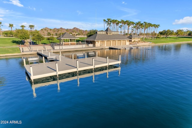 dock area with a water and mountain view and a gazebo