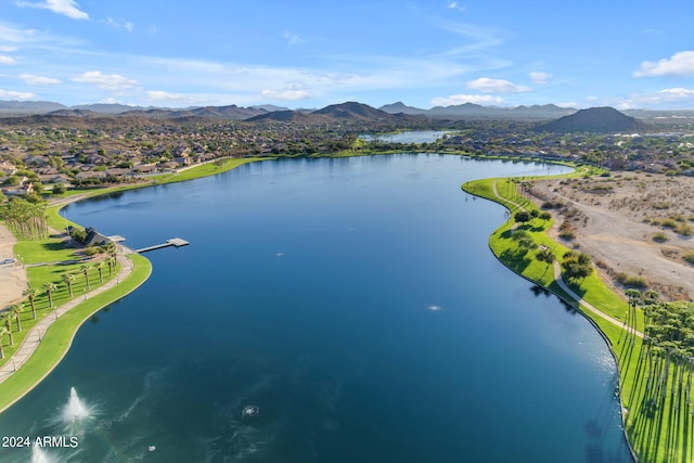 birds eye view of property featuring a water and mountain view