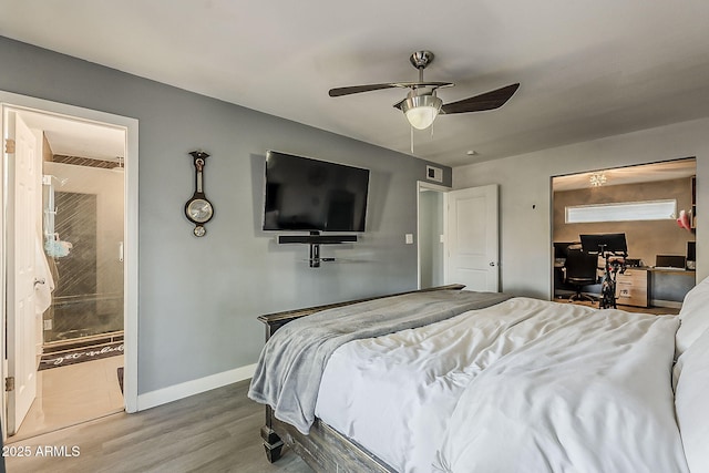 8137 E Indian School Rd, Scottsdale, AZ 85251 - bedroom featuring an office area, wood finished floors, and ceiling fan