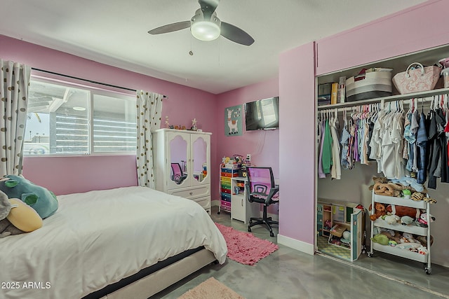 8137 E Indian School Rd, Scottsdale, AZ 85251 - bedroom featuring a closet, concrete floors, and a ceiling fan