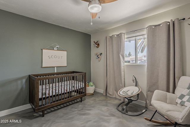 8137 E Indian School Rd, Scottsdale, AZ 85251 - bedroom featuring finished concrete floors, a nursery area, and ceiling fan