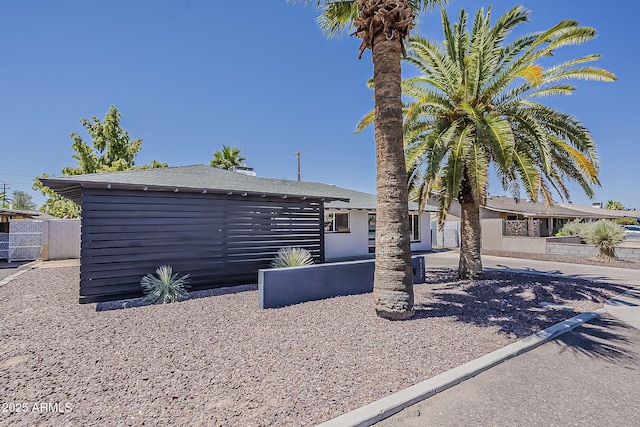 8137 E Indian School Rd, Scottsdale, AZ 85251 - view of front of house with a shingled roof