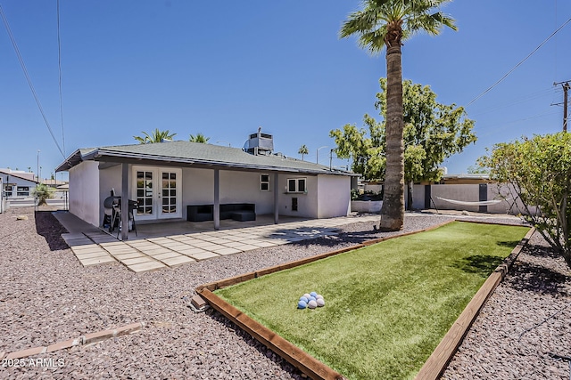 8137 E Indian School Rd, Scottsdale, AZ 85251 - rear view of house with french doors, stucco siding, and a patio area