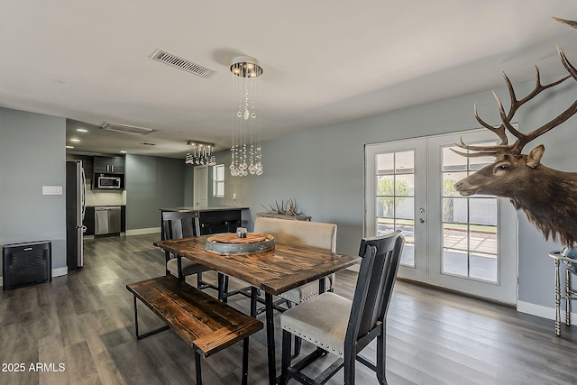 8137 E Indian School Rd, Scottsdale, AZ 85251 - dining space with dark wood-style flooring and french doors