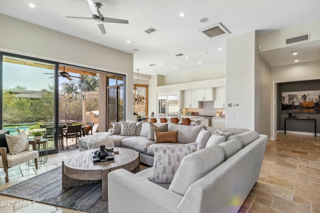 living room with sink and ceiling fan