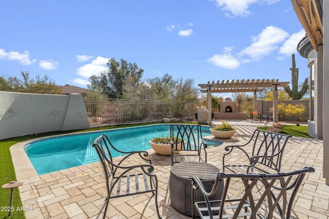 view of swimming pool featuring an outdoor fireplace, a patio, and a pergola