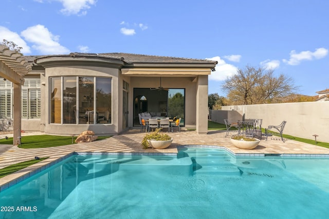 view of pool featuring ceiling fan and a patio