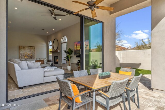 sunroom / solarium with ceiling fan