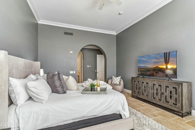 bedroom with ornamental molding and ceiling fan