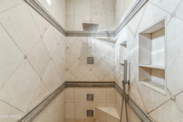 bathroom with a tile shower