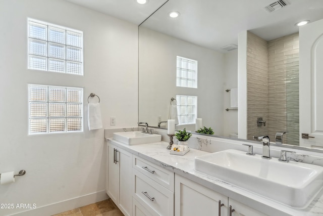 bathroom with vanity and walk in shower