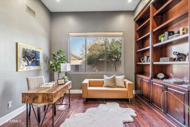 home office with dark hardwood / wood-style flooring