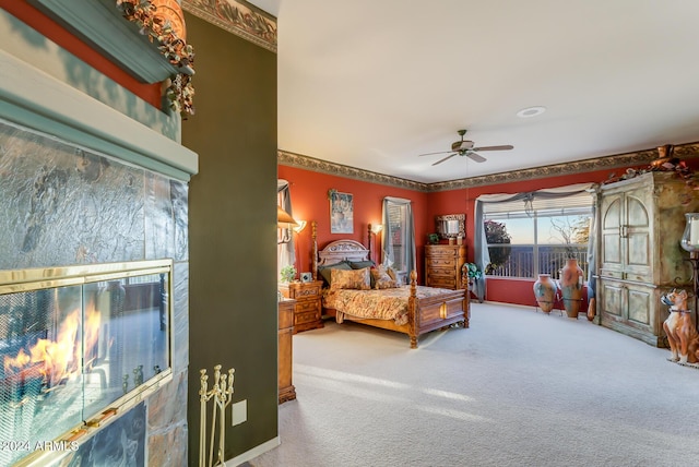 bedroom featuring ceiling fan and carpet