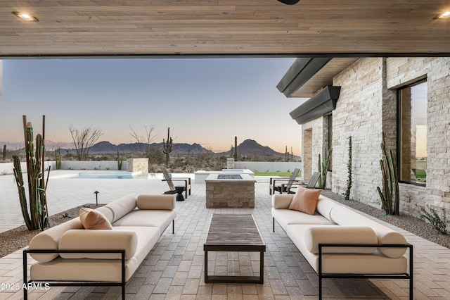 28805 N 114th St, Scottsdale, AZ 85262 - view of patio / terrace with a mountain view, an outdoor living space with a fire pit, and a fenced in pool