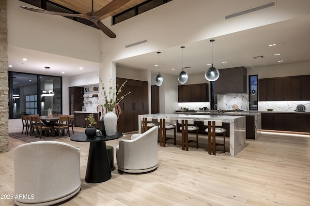28805 N 114th St, Scottsdale, AZ 85262 - interior space featuring a high ceiling, a ceiling fan, light wood finished floors, and visible vents