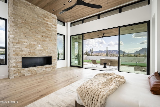 28805 N 114th St, Scottsdale, AZ 85262 - bedroom with access to outside, wood ceiling, a mountain view, a fireplace, and wood finished floors