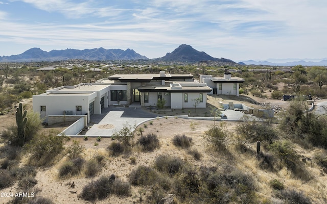 rear view of house with a mountain view