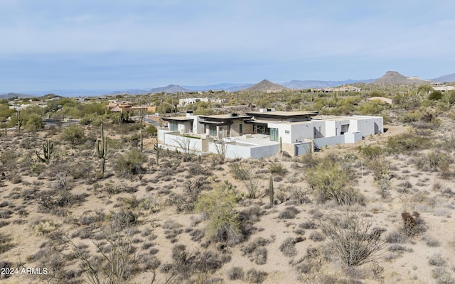 back of house featuring a mountain view