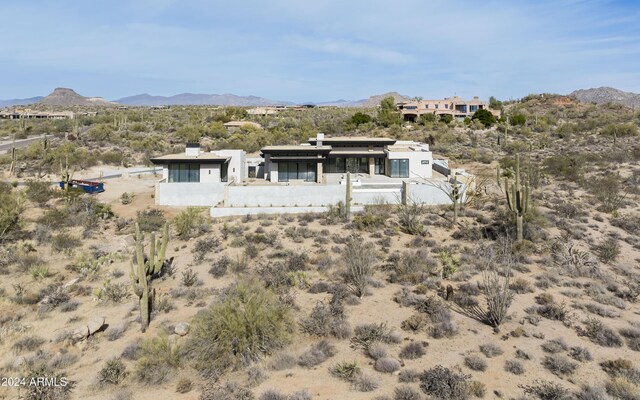 rear view of property featuring a mountain view