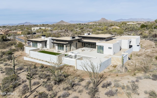 drone / aerial view featuring a mountain view