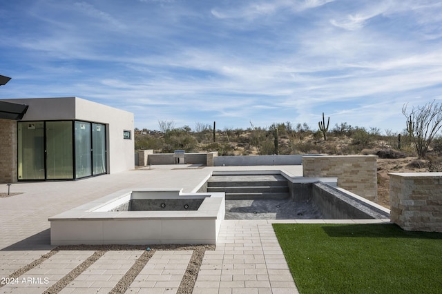 view of patio with a fire pit