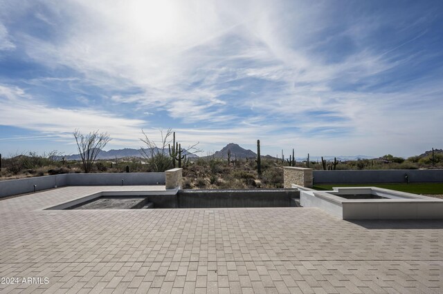 view of patio / terrace with a mountain view