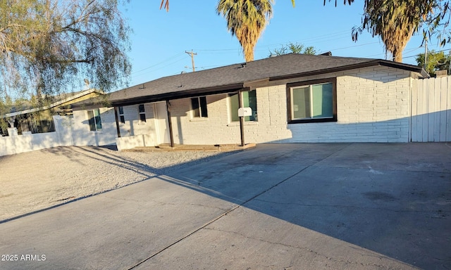 3421 W Montecito Ave, Phoenix, AZ 85017 - rear view of property featuring brick siding and a shingled roof