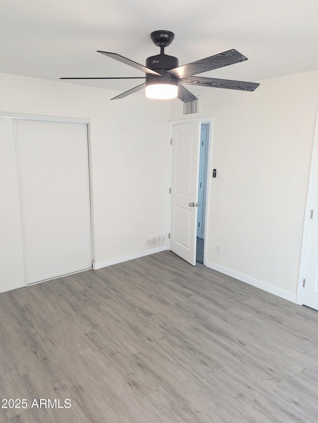 3421 W Montecito Ave, Phoenix, AZ 85017 - unfurnished bedroom featuring wood finished floors, a closet, and ceiling fan