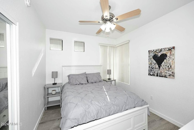 bedroom featuring light hardwood / wood-style floors and ceiling fan