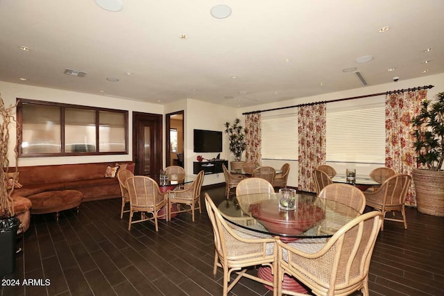 dining area featuring dark hardwood / wood-style floors