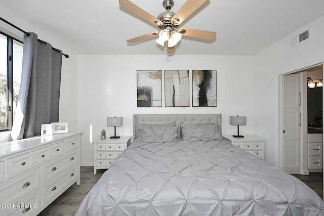 bedroom with ceiling fan and dark hardwood / wood-style flooring