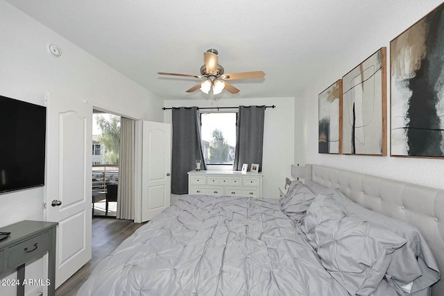 bedroom featuring ceiling fan and dark hardwood / wood-style floors