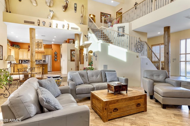 living room with a towering ceiling