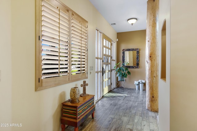 corridor featuring hardwood / wood-style floors