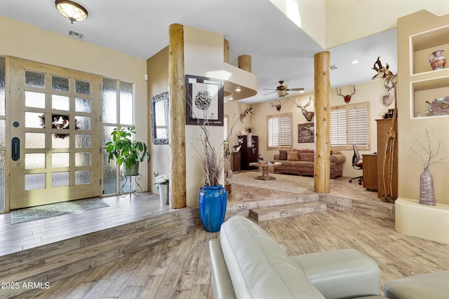 living room with ceiling fan and wood-type flooring