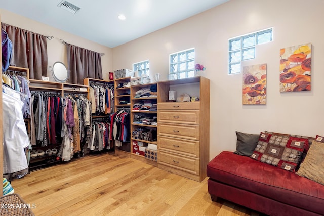 walk in closet featuring light hardwood / wood-style floors