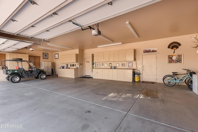 garage featuring a garage door opener