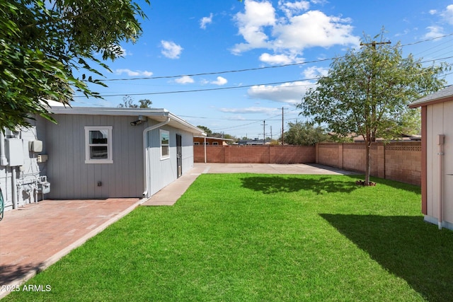 view of yard featuring a patio and a fenced backyard