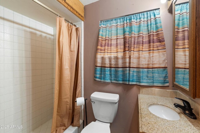 bathroom with toilet, vanity, and shower / tub combo