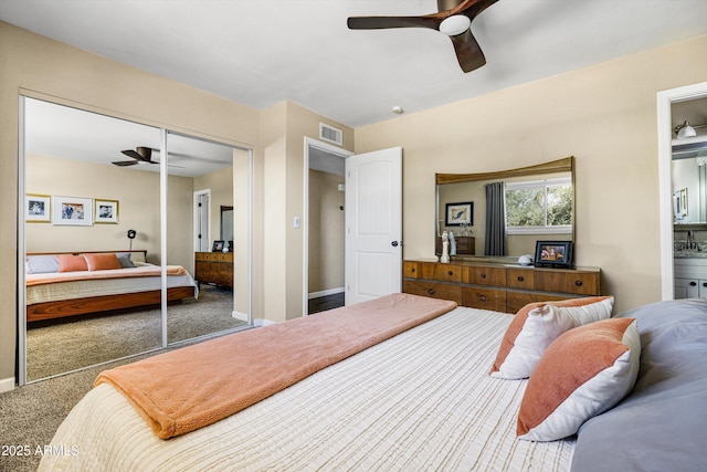 8502 E Rose Ln, Scottsdale, AZ 85250 - carpeted bedroom with a ceiling fan, a closet, connected bathroom, and baseboards