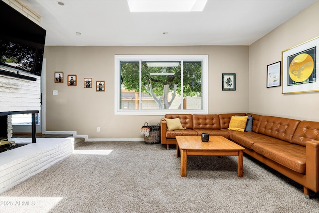 8502 E Rose Ln, Scottsdale, AZ 85250 - living area with plenty of natural light, a brick fireplace, carpet flooring, and a skylight
