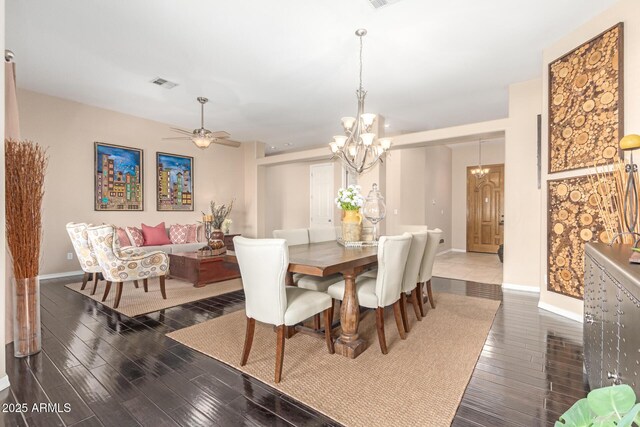 6719 N 15th Ave, Phoenix, AZ 85015 - dining room with baseboards, wood finished floors, a chandelier, and a ceiling fan