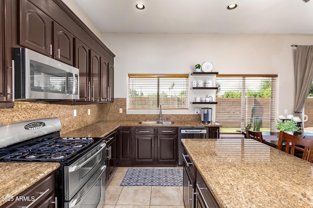6719 N 15th Ave, Phoenix, AZ 85015 - kitchen with stainless steel appliances, a sink, healthy amount of natural light, dark brown cabinets, and recessed lighting