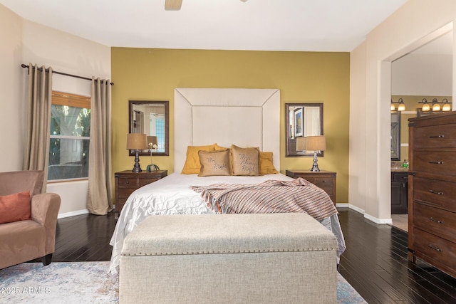 6719 N 15th Ave, Phoenix, AZ 85015 - bedroom featuring dark wood-style floors, baseboards, connected bathroom, and a ceiling fan