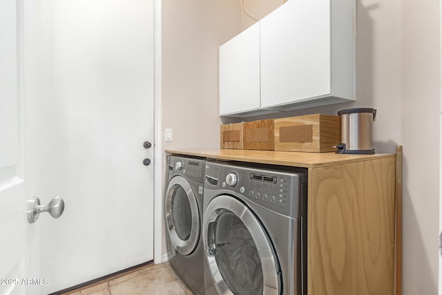 6719 N 15th Ave, Phoenix, AZ 85015 - clothes washing area featuring separate washer and dryer, cabinet space, and light tile patterned floors