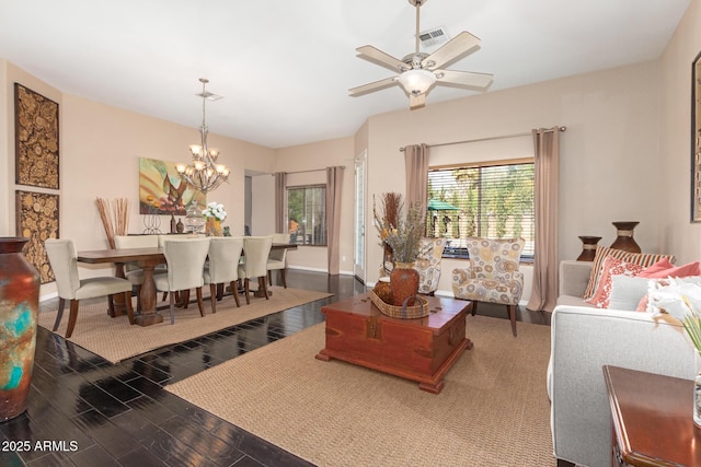 6719 N 15th Ave, Phoenix, AZ 85015 - living area featuring wood finished floors, a chandelier, and baseboards